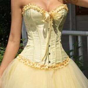 Yellow corset top with ruffles and ribbon